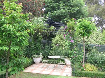 Pergola In The Corner Of The Garden